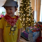 Nolan and the tree loaded with presents